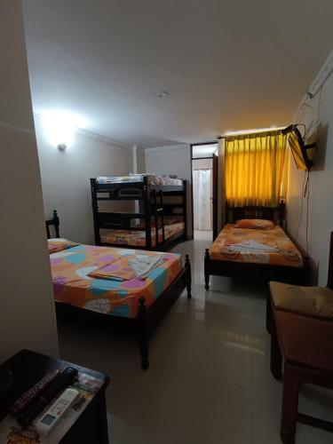 Un ou plusieurs lits dans un hébergement de l'établissement Hotel Danes Barranquilla