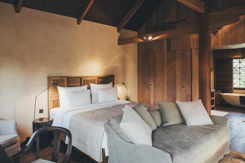 Ein Bett oder Betten in einem Zimmer der Unterkunft Zannier Phum Baitang