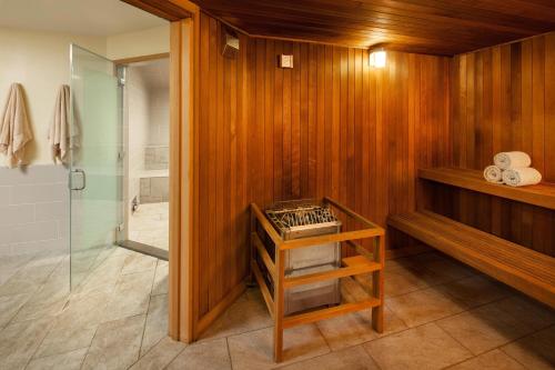 a bathroom with a shower and a wooden wall at The Westin Ka'anapali Ocean Resort Villas in Lahaina