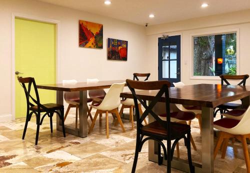 a dining room with a wooden table and chairs at Retreat at Crystal Manatee in Crystal River