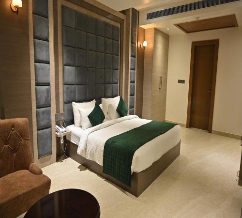 Un ou plusieurs lits dans un hébergement de l'établissement Hotel Gold In Leaf