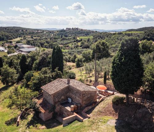 an aerial view of a stone house in a field at CasaMoira in Trequanda