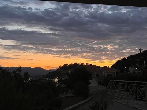 a view of the sunset from the balcony of a house at Villa Myrto in Kyparissia