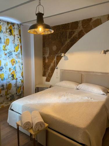a bedroom with a large bed and a ceiling at BB Orvieto in Orvieto