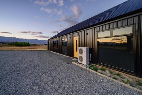 a building with a speaker on the side of it at 31 on Boundary in Twizel