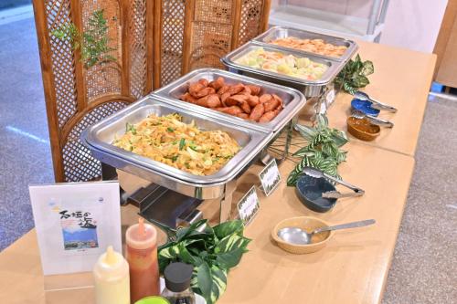 a table with two trays of food on it at Iriomotejima-Jungle Hotel Painumaya in Iriomote