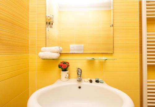 a bathroom with a sink and a mirror at Agriturismo I Tesori del Sud Vieste, Puglia in Vieste