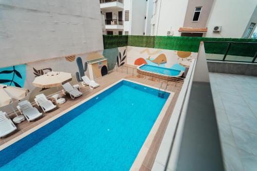 an overhead view of a swimming pool in a building at Fortunella Suites in Finike