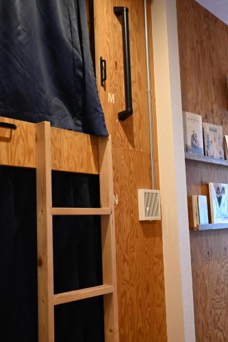 a door to a room with a bunk bed at 36hostel in Hiroshima