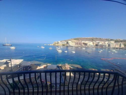 a view of a harbor with boats in the water at Seaview Apartment in Żebbuġ