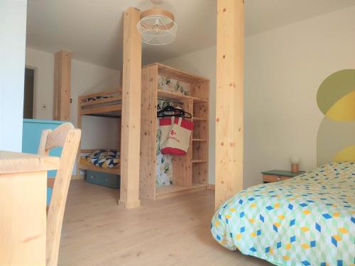 a bedroom with a bunk bed and a bunk bed at ACCOTINAE in Mont-Saxonnex