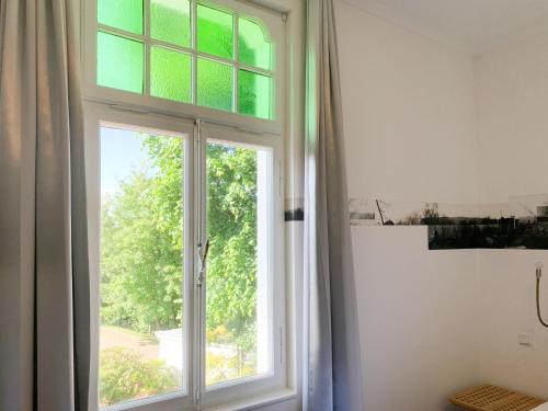 an open window in a white room with at 2T Hotel artgenossen in Lindlar