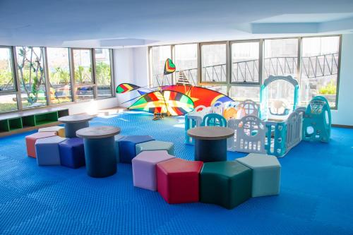 a childrens room with a play area with a playground at Bellerive Hoi An Resort and Spa in Hoi An
