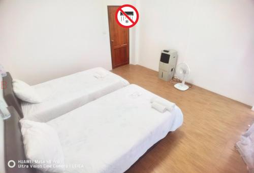Postel nebo postele na pokoji v ubytování YYK Hostel 24H