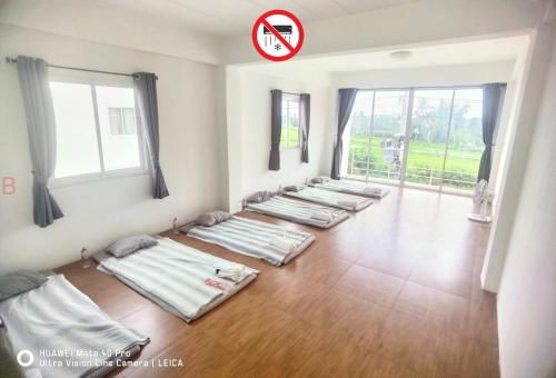 Postel nebo postele na pokoji v ubytování YYK Hostel 24H