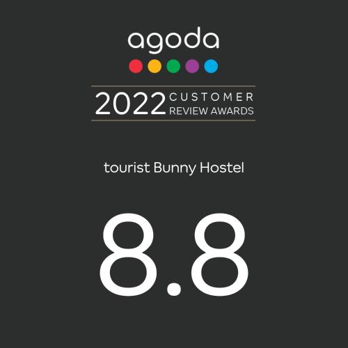 a logo for a customer review awards at Tourist Bunny Hostel in Tamsui
