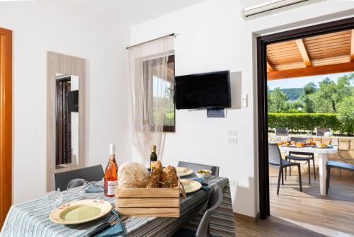 a dining room with a table with a basket of food at Agriturismo I Tesori del Sud Vieste, Puglia in Vieste