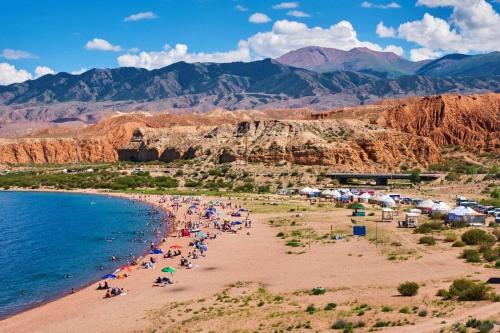 a group of people on a beach near the water at Private Luxury Villa - Issyk Kul in Cholpon-Ata