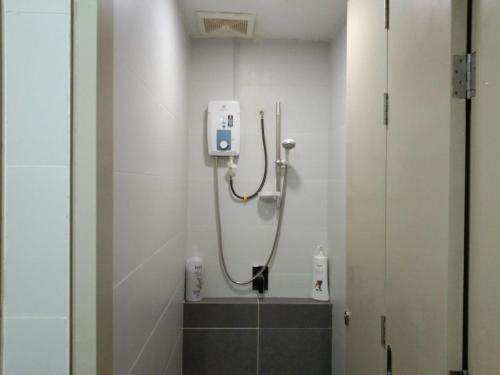 a bathroom with a shower in a room at PINTARMAN EXPRESS @ MIRI TIMES SQUARE in Miri