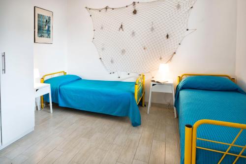 Postel nebo postele na pokoji v ubytování siciliacasevancaze - Villa Torre