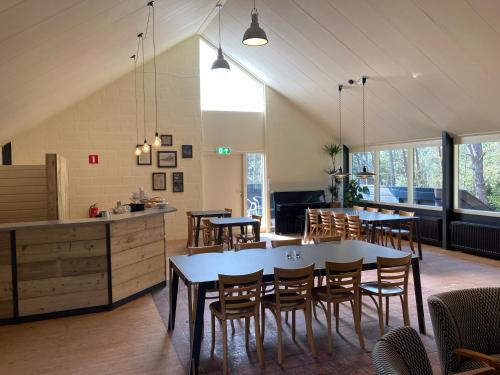 a kitchen and dining room with a table and chairs at De Folks in Hoorn