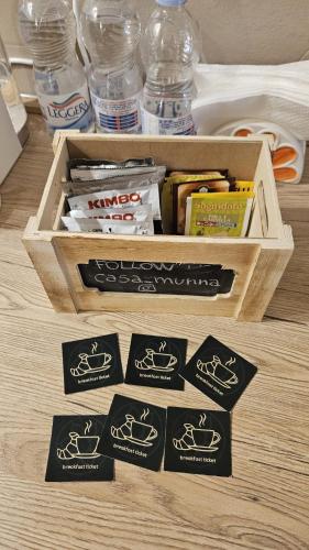 a wooden box with labels on top of a table at Casa Munna in Ceglie Messapica