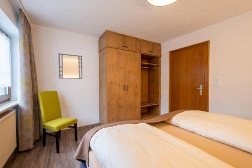 Ένα ή περισσότερα κρεβάτια σε δωμάτιο στο Ferienhaus Olympia