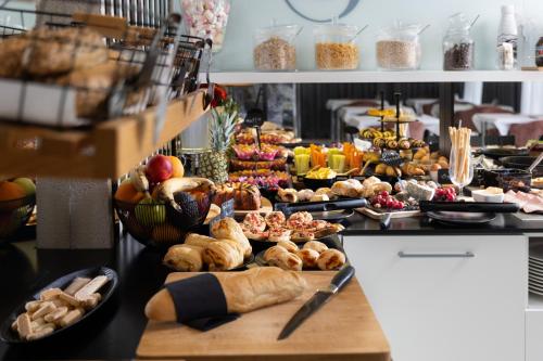 a buffet with a lot of different types of food at Hotel 9 in Zagreb