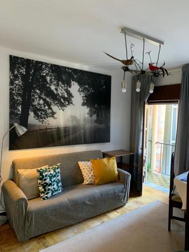 a living room with a couch with pillows on it at Grandma's Carolina Villa in Sul