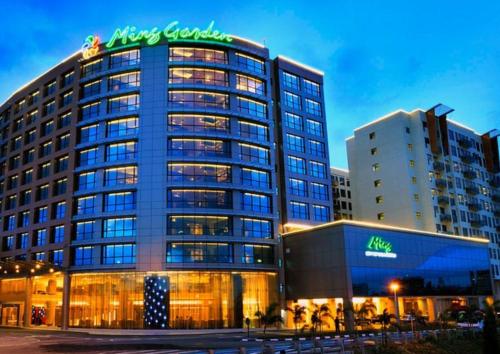 a large building with a sign on top of it at Deluxe Twin Room AYS in Kota Kinabalu