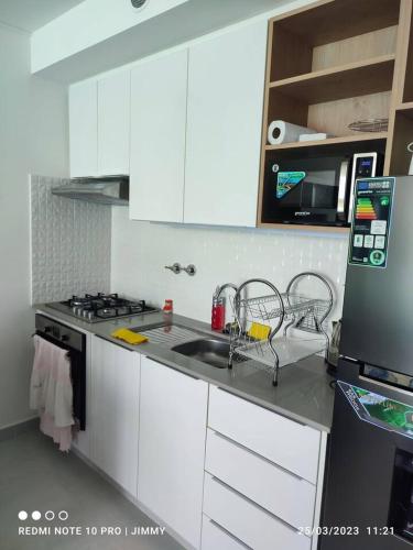 Kuchyň nebo kuchyňský kout v ubytování Mar Adentro Lujoso Departamento con Playa