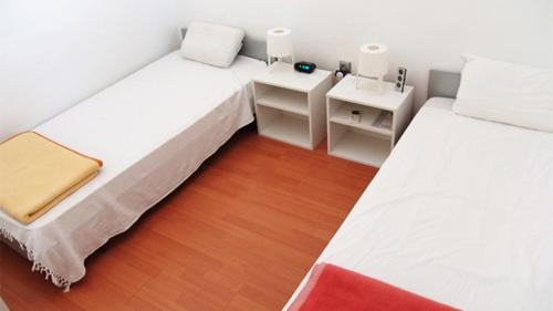Ένα ή περισσότερα κρεβάτια σε δωμάτιο στο Holiday House BugenVilla DTOSI
