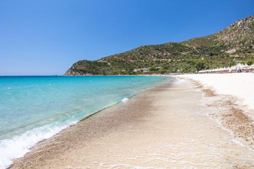 a view of a beach with the ocean at Cormoran Residence in Villasimius