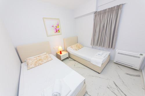 Ένα ή περισσότερα κρεβάτια σε δωμάτιο στο Luxury Villa 5