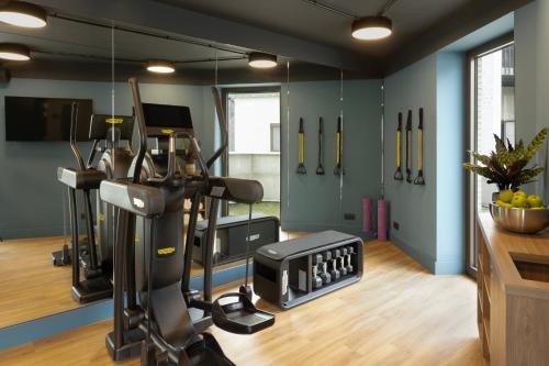 a room with a gym with a treadmill at Adagio Antwerp City Center in Antwerp