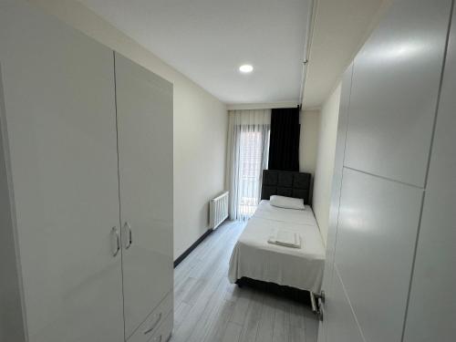Postel nebo postele na pokoji v ubytování Rose Plus Residence