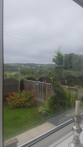 a window with a view of a yard at 31 riverside in Great Clifton