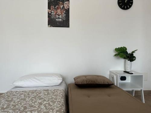 מיטה או מיטות בחדר ב-Fleming20 Cimmino- San Siro, Rho Fiera, Milano Centro
