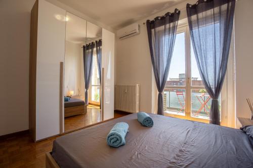 Postel nebo postele na pokoji v ubytování Last Apartment Milano