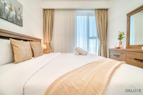Postel nebo postele na pokoji v ubytování Charming 3BR at 17 Icon Bay Dubai Creek Harbour by Deluxe Holiday Homes