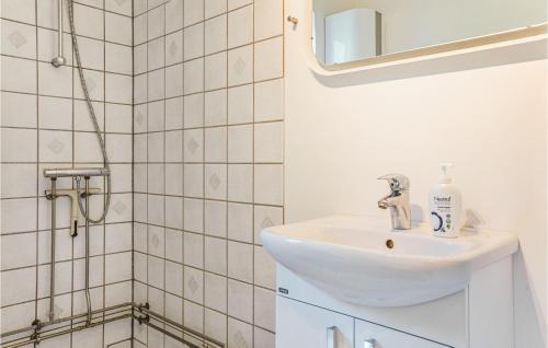a bathroom with a sink and a shower at Amazing Home In Borup With 2 Bedrooms And Wifi in Borup
