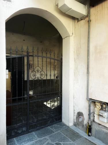 an entrance to a building with a wrought iron gate at La Palma apartment in Vigevano