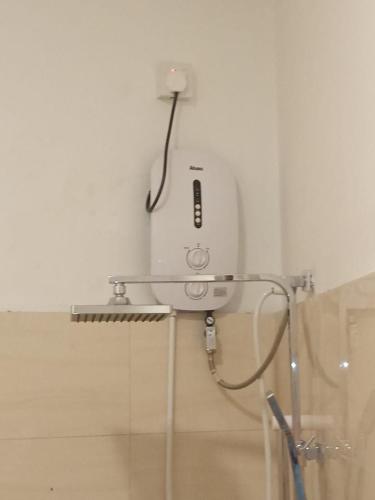 a white appliance sitting on top of a wall at NOVA Guest in Mirissa