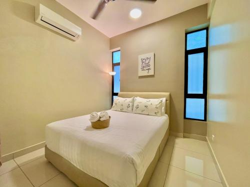 a bedroom with a bed with white sheets and a window at Citywoods 2B2BR - JB Town near HSA, CIQ, Mall - WiFi in Johor Bahru