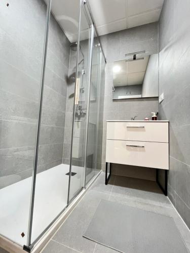 a bathroom with a shower and a sink and a toilet at Acogedor Infanta Mercedes in Madrid