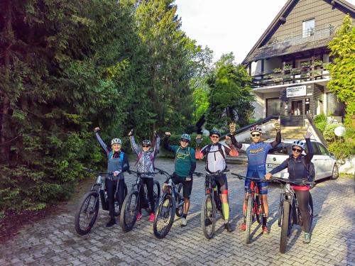 a group of people on bikes posing for a picture at Prenočišča Mraz in Velenje