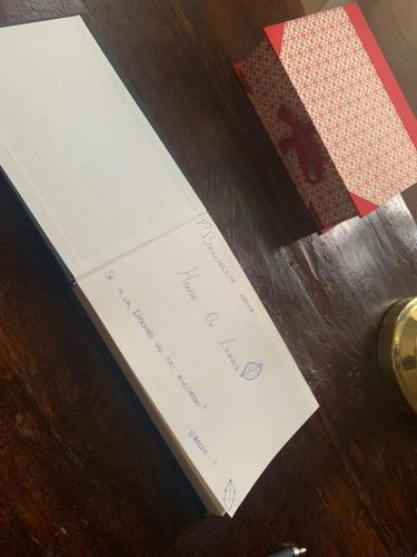 a piece of paper sitting on top of a table at House of Leaves in Trevi