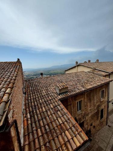 an overhead view of roofs of two buildings at House of Leaves in Trevi