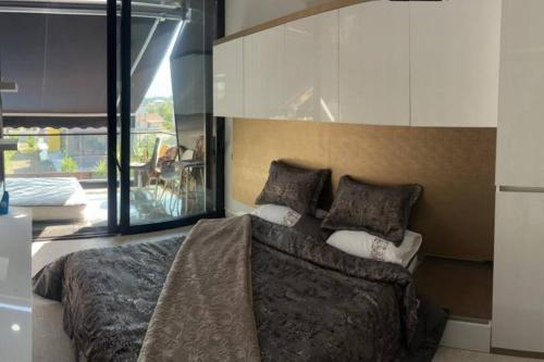 a bedroom with a large bed with pillows on it at Boutique hotel with a heat pool in Dosemealti