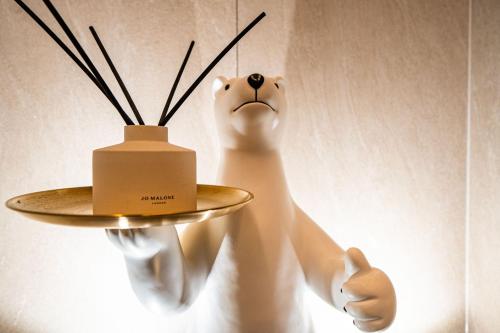 aumedumed bear with a plate on a wall at WABA Classic Gwanganri in Busan